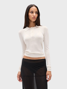 Elegant ivory Shea Knit Top with a comfortable design, perfect for everyday wear or stylish layering.