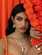 Silver necklace designed in the shape of a Diya, highlighting fine craftsmanship.