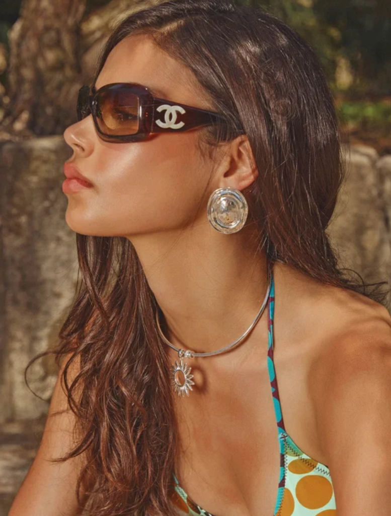 Lightweight silver earrings with a bold hand-hammered design, 4.5cm drop, and secure omega backing for pierced ears.
