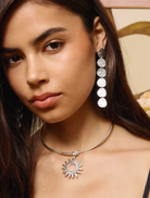 Silver drop earrings with a hand-hammered finish, lightweight design, and IP gold plating on recycled brass, measuring 9.2 cm.