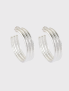 Bold 4cm drop silver hoop earrings, triple textured, crafted from recycled brass for a stylish and lightweight wear.
