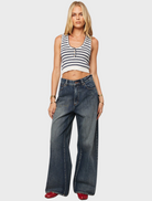 Cropped top featuring horizontal stripes in white and blue colors.


