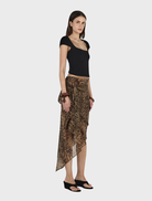 The Sirocco Phaedra Skirt showcases a bold leopard print fabric.
