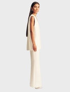 Otis sleeveless blazer in a soft ivory hue, perfect for layering over tops for a sophisticated appearance.