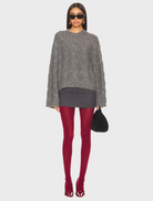 Burgundy solid tights displayed on a white background, showcasing their smooth texture and rich color.