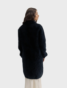 Black Sophia Open Cashmere Cardigan with a relaxed fit, highlighting its luxurious fabric and stylish open-front silhouette.