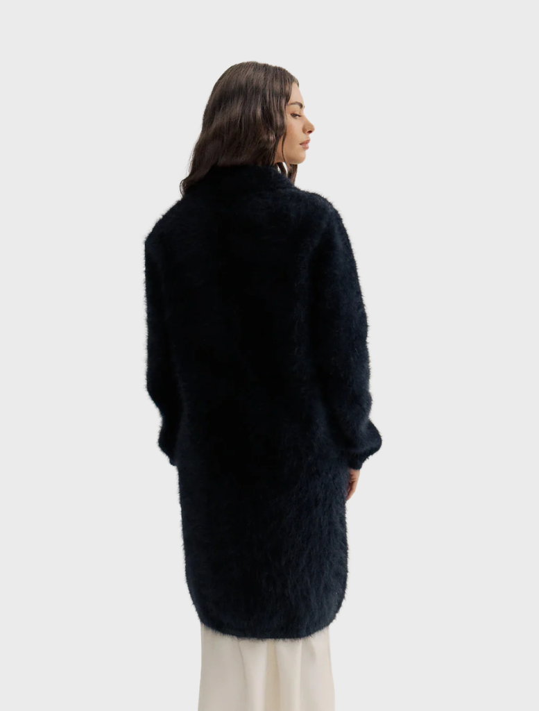 Black Sophia Open Cashmere Cardigan with a relaxed fit, highlighting its luxurious fabric and stylish open-front silhouette.