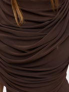 Ash Sorella bodysuit featured on a hanger, illustrating its minimalist design and soft fabric.