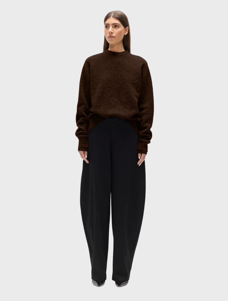 A cozy crew neck sweater featuring a bear graphic, perfect for casual wear and outdoor activities.