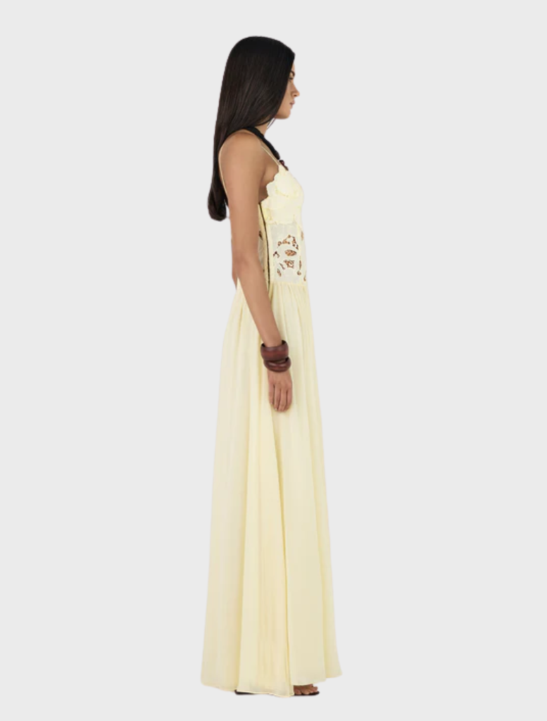 Flowing Stephanie maxi dress in a delicate butter tone, perfect for casual wear or special summer gatherings.