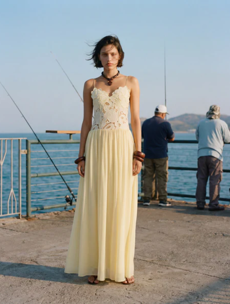 Long, flowing Stephanie maxi dress in a soft butter color, perfect for warm weather and casual outings.