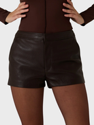 Stylish dark truffle vegan leather shorts, offering a modern look while promoting sustainable fashion.