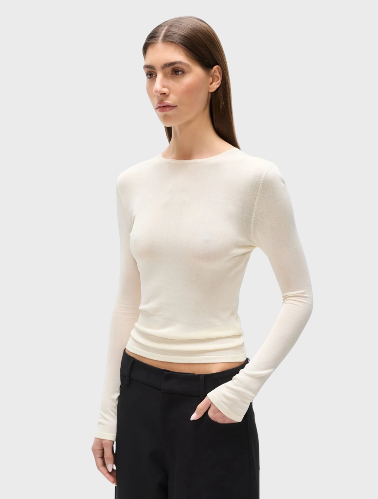 Ivory top designed by Stevie, showcasing a contemporary cut and versatile style for casual or formal wear.