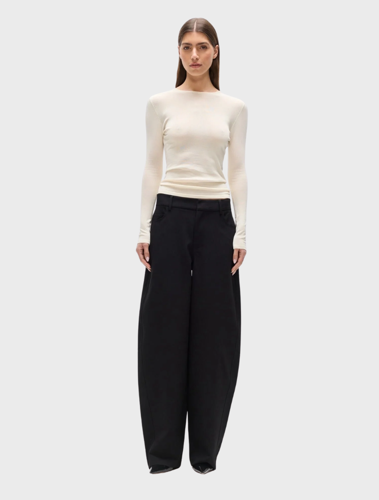 A stylish ivory top by Stevie, featuring a modern design and elegant fabric suitable for various occasions.