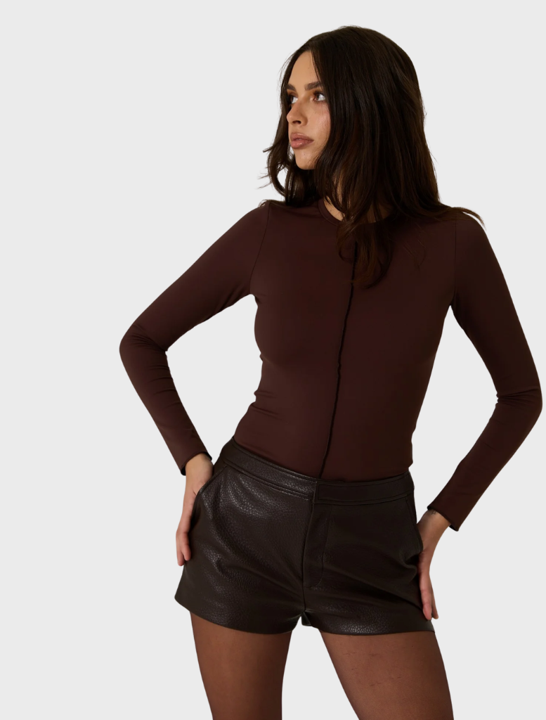Modern dark truffle vegan leather shorts, designed for a stylish and environmentally friendly outfit option.
