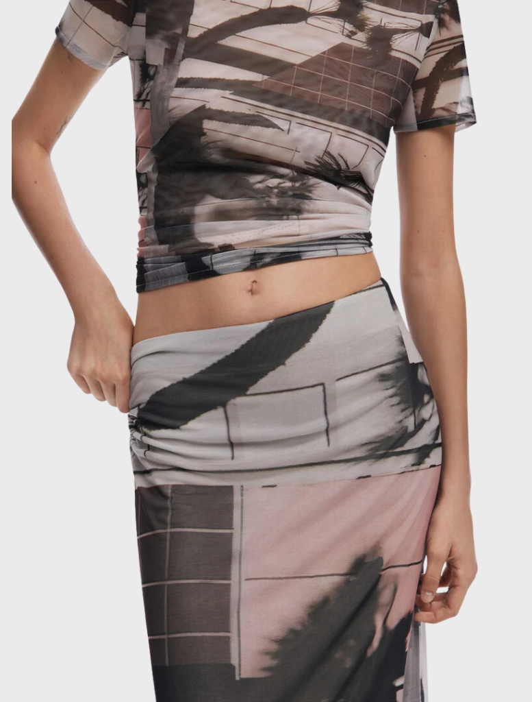 Stylish straight tulle skirt featuring a vibrant artistic print, perfect for adding a creative touch to your ensemble.