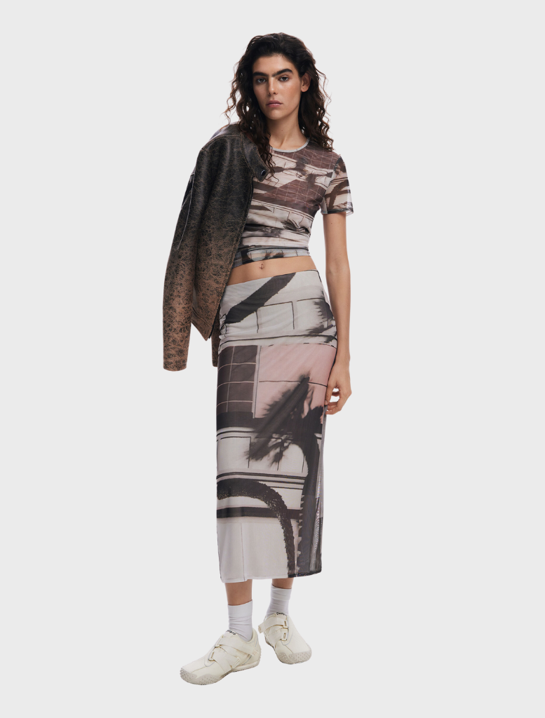 Straight tulle skirt featuring an artistic print, showcasing a blend of colors and patterns for a unique look.