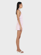 Baby pink skort by Nikita, featuring studded details for a contemporary and stylish outfit.