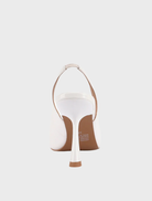 Classic white Celeste pump with a pointed toe design, perfect for adding sophistication to any ensemble.