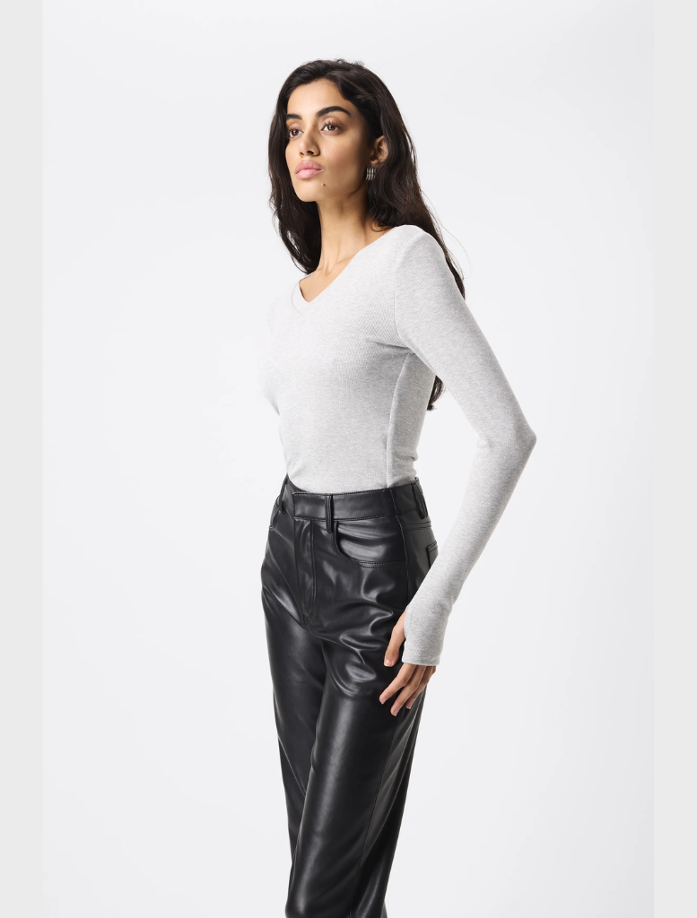 A pair of black Fairfax pants laid flat, featuring a tailored fit and versatile style for both casual and formal wear.