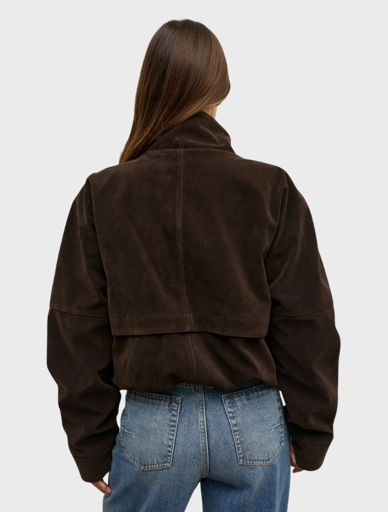  Deep brown Inez jacket displayed on a hanger, featuring a sleek design and modern silhouette.