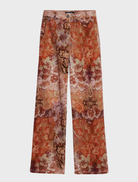 Vibrant long trousers in orange, presented on a plain surface, ideal for adding a pop of color to any casual wardrobe.