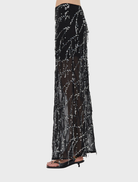 Stylish black maxi skirt featuring a bias cut, offering a modern and elegant silhouette.
