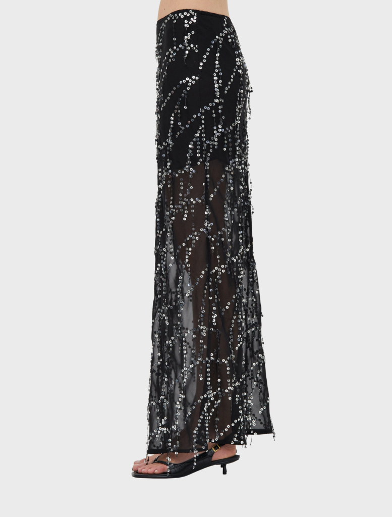 Stylish black maxi skirt featuring a bias cut, offering a modern and elegant silhouette.