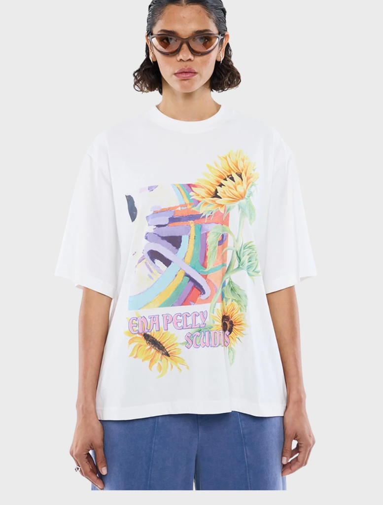 White vintage tee featuring a sunflower motif, combining comfort and style for a fresh, casual outfit choice.