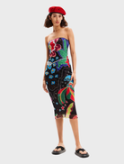 Neutral grey Swim Jungle Dress displayed on a mannequin, featuring a relaxed fit and tropical print accents.