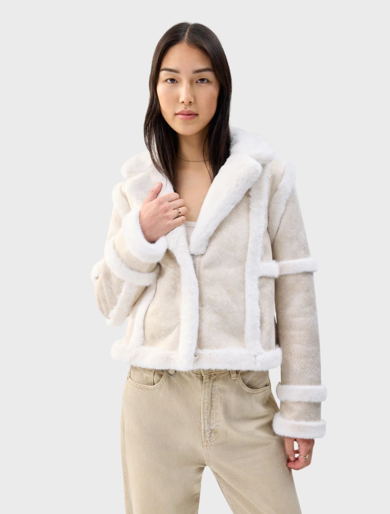 Cream Talamasca jacket presented, emphasizing its chic design and comfortable fit for both casual and formal wear.