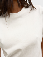 Front view of a white Tess T-shirt, showcasing its minimalist style and comfortable fit for everyday use.