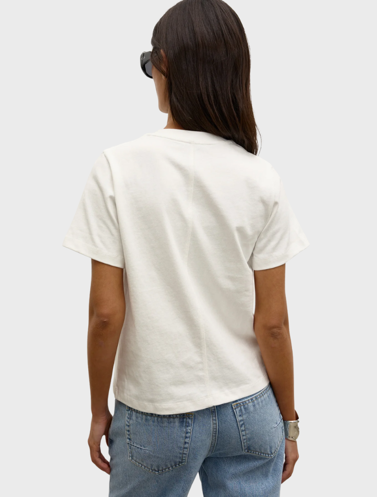 White Tess T-shirt laid flat, highlighting its clean lines and versatile design for casual outfits.