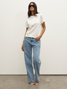 Front view of a white Tess T-shirt, showcasing its minimalist style and comfortable fit for everyday use.