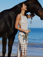 Chic backless maxi dress with a lightweight fabric, designed for comfort and elegance during summer gatherings.