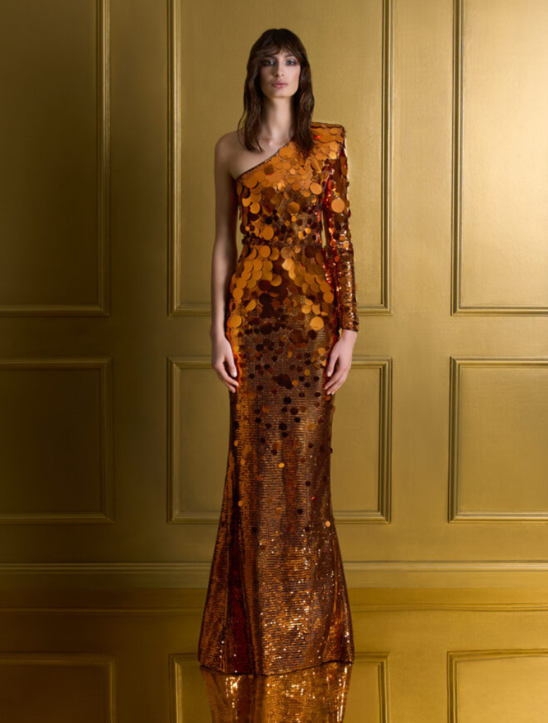 Orange prism gown with shimmering fabric, showcasing a vibrant and elegant design suitable for formal occasions.