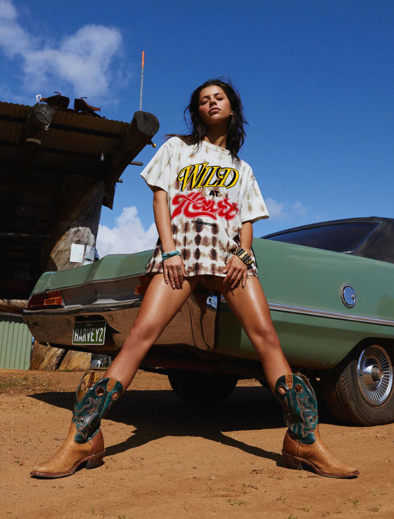 A stylish Signature Tee featuring a vibrant Wild Hearts graphic, perfect for casual wear and expressing individuality.