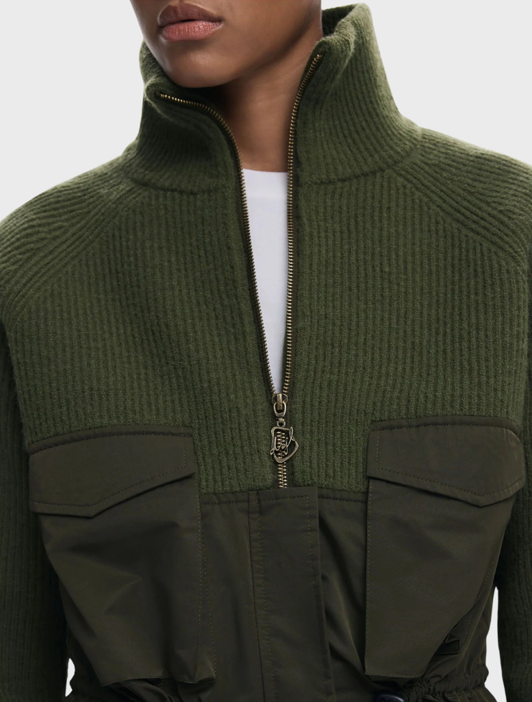 Sturdy khaki jacket made from thick fabric, designed for comfort and protection against the elements.