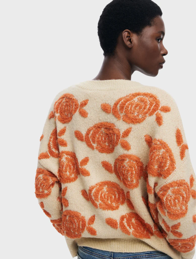 Thick gauge jacket showcasing a lively floral design, perfect for adding flair while staying warm in cooler temperatures.