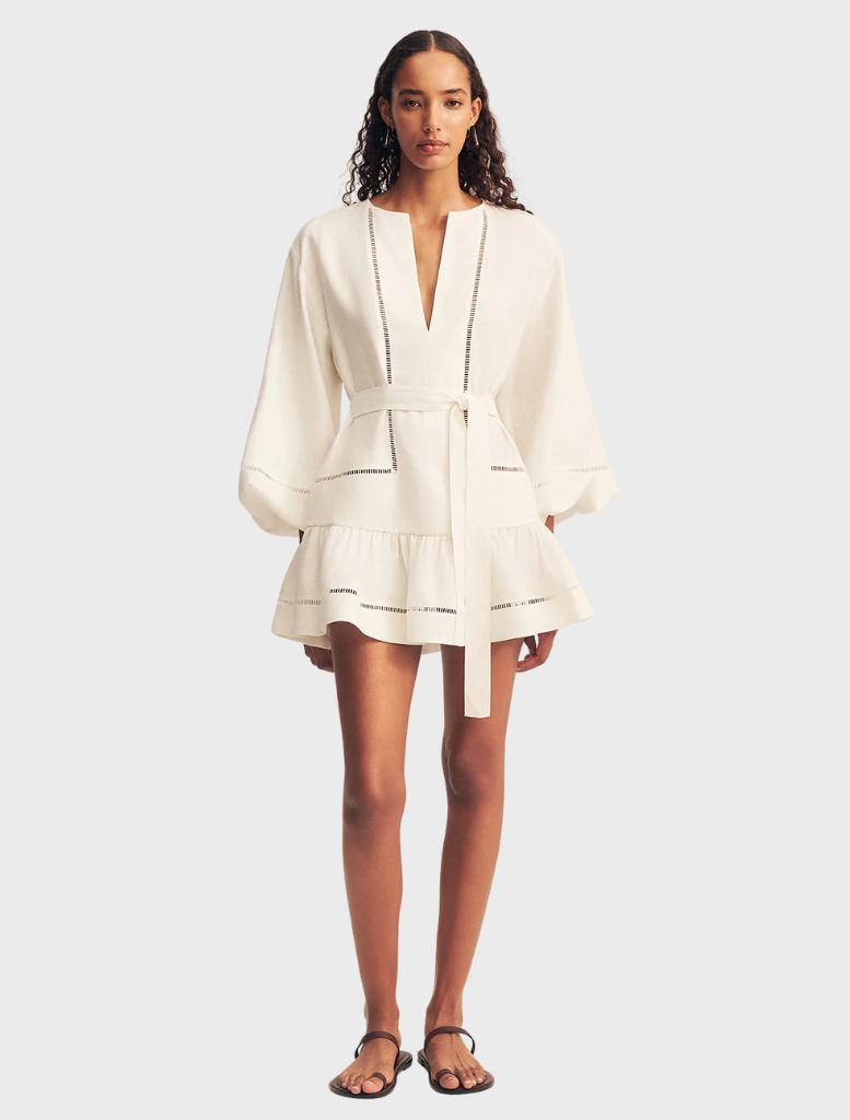 Ivory mini dress with balloon sleeves, featuring a fitted bodice and flared skirt, ideal for casual or semi-formal occasions.