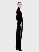 Valentina Stripe Pant, designed with black and off-white stripes, offering a fashionable look for various occasions.