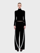 Elegant black and off-white striped Valentina pants, perfect for adding a modern touch to any outfit.
