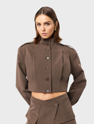 Mocha-colored Vault Bomber jacket displayed on a hanger against a neutral background.