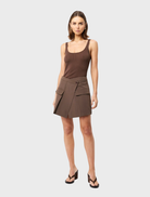 Stylish mocha Vault Mini Skirt featured on a light background, illustrating its contemporary design and fabric quality.