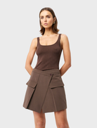 Mocha-colored Vault Mini Skirt displayed on a white background, showcasing its stylish design and fabric texture.