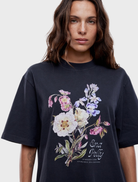 Vintage black Bouquet Tee adorned with a delicate floral design, combining comfort and style effortlessly.