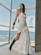 White Violetta ruched maxi dress, designed with a fitted top and a long, flowing skirt for a sophisticated look.