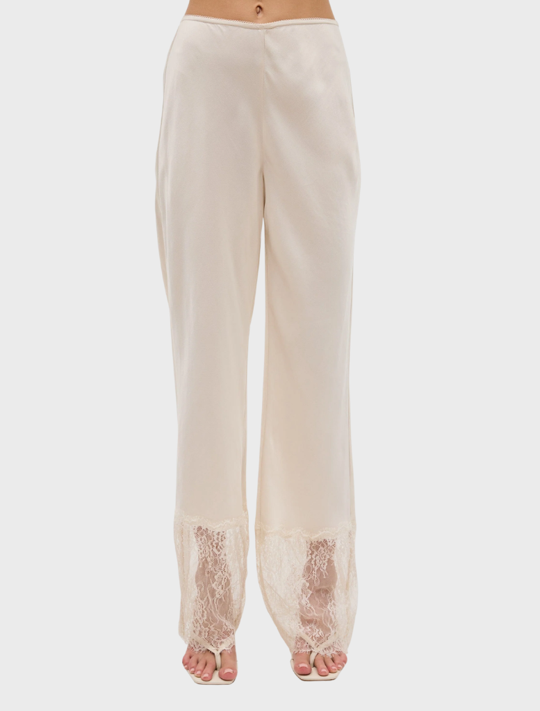 Elegant buttercream lace pant featuring a scalloped waistband and sheer lace hem, offering a refined and fluid silhouette.