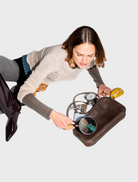 Brown leather handbag with two handles, displayed to illustrate its chic and practical features.