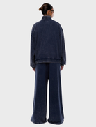 The Asher Quarter Zip in Washed Ink by ENA PELLY, reflecting a fusion of contemporary design and classic sophistication.
